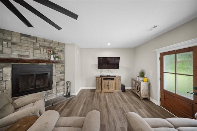 6401 SE Hamilton Rd, Holt, MO 64048 - living area featuring wood finished floors, a fireplace, and recessed lighting
