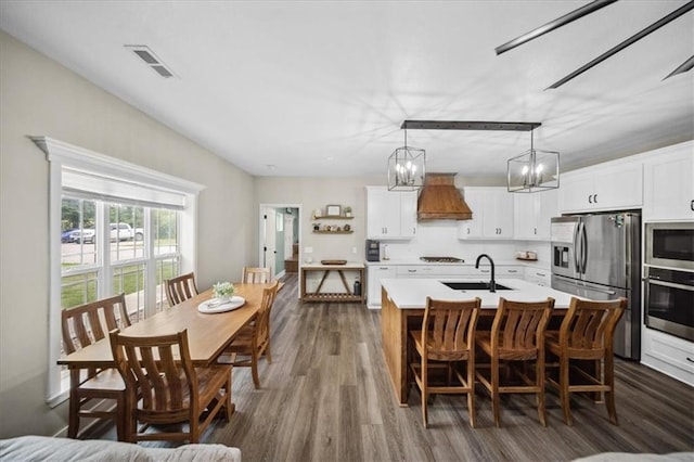 6401 SE Hamilton Rd, Holt, MO 64048 - dining space with dark wood-style floors and a chandelier