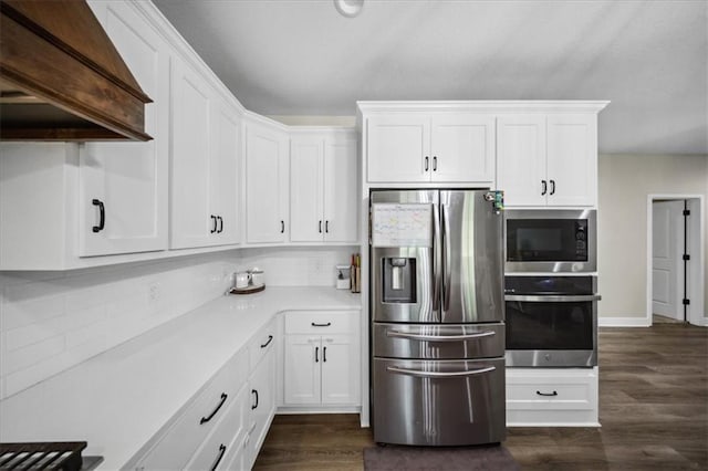 6401 SE Hamilton Rd, Holt, MO 64048 - kitchen featuring appliances with stainless steel finishes, custom range hood, white cabinetry, and light countertops