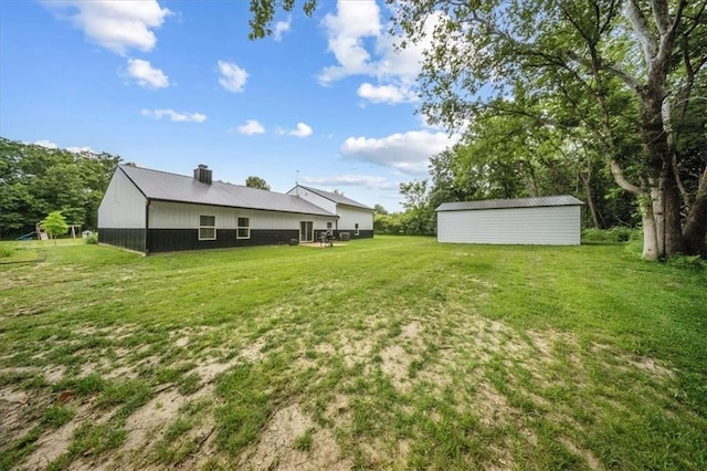 6401 SE Hamilton Rd, Holt, MO 64048 - view of grassy yard featuring an outbuilding