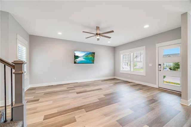23506 E 10th St S, Independence, MO 64056 - unfurnished living room featuring light wood-style floors, ceiling fan, recessed lighting, and stairway