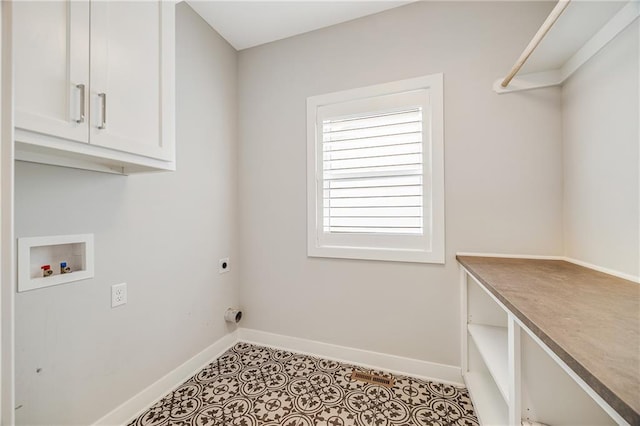 23506 E 10th St S, Independence, MO 64056 - laundry room with cabinet space, electric dryer hookup, washer hookup, and tile patterned floors