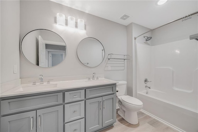 23506 E 10th St S, Independence, MO 64056 - full bath with double vanity, shower / bath combination, and wood finished floors