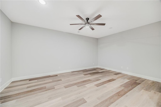 23506 E 10th St S, Independence, MO 64056 - empty room with a ceiling fan and light wood-style floors