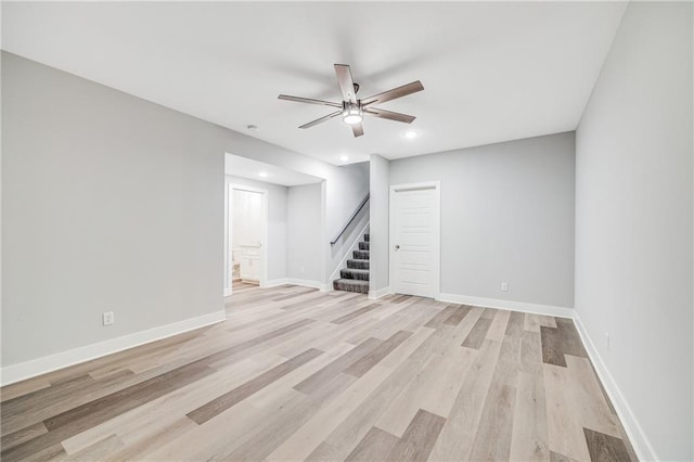 23506 E 10th St S, Independence, MO 64056 - basement with stairway, ceiling fan, light wood-style floors, and recessed lighting