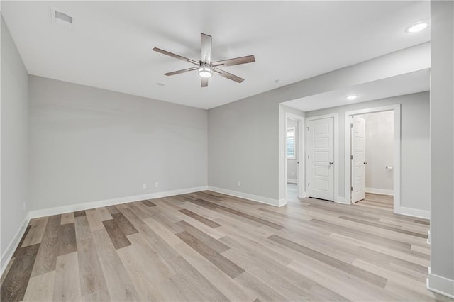 23506 E 10th St S, Independence, MO 64056 - spare room featuring light wood finished floors, ceiling fan, and recessed lighting