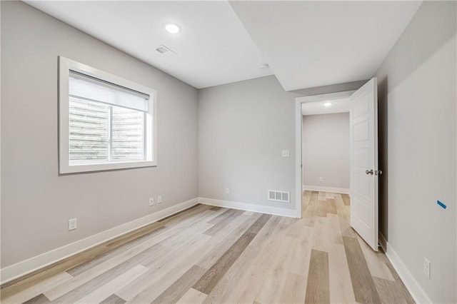 23506 E 10th St S, Independence, MO 64056 - empty room featuring light wood-type flooring and recessed lighting