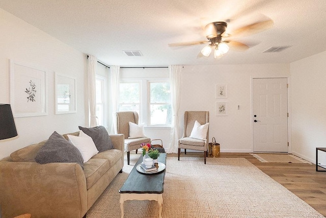 319 E 12th St, Ottawa, KS 66067 - living room with wood finished floors and a ceiling fan