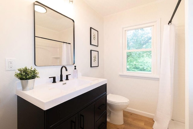 319 E 12th St, Ottawa, KS 66067 - bathroom with vanity, wood finished floors, and a shower with shower curtain
