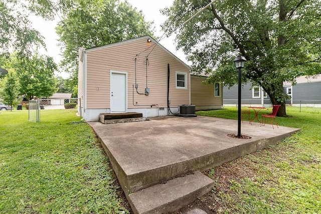 319 E 12th St, Ottawa, KS 66067 - back of house with a patio area and crawl space