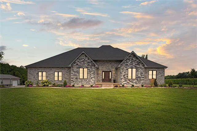 6417 County Road 10508th Rd, Rich Hill, MO 64779 - view of front facade featuring a lawn, a garage, and a shingled roof