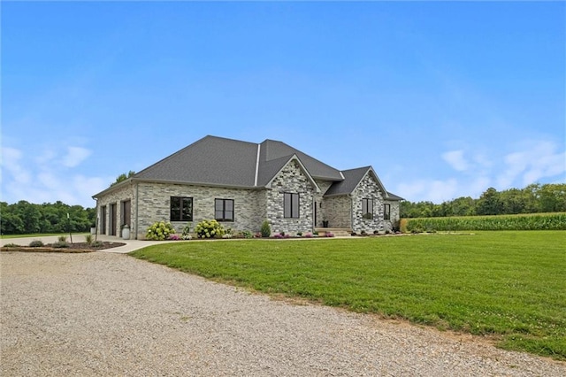 6417 County Road 10508th Rd, Rich Hill, MO 64779 - french country home with a front yard, driveway, an attached garage, and stone siding