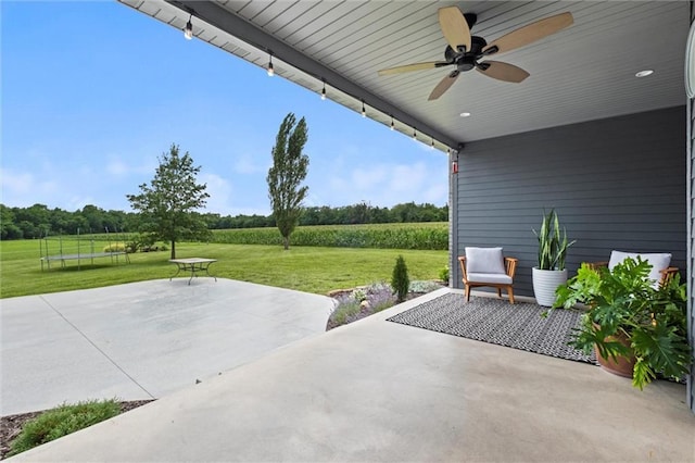 6417 County Road 10508th Rd, Rich Hill, MO 64779 - view of patio / terrace featuring ceiling fan and a view of rural / pastoral area