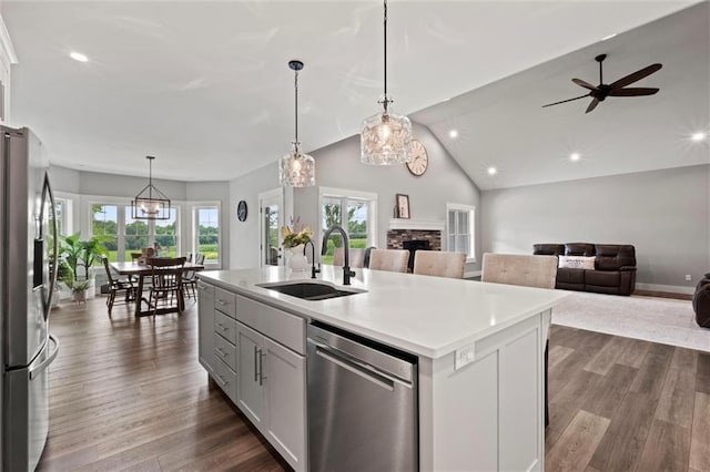 6417 County Road 10508th Rd, Rich Hill, MO 64779 - kitchen with stainless steel appliances, recessed lighting, a stone fireplace, plenty of natural light, and open floor plan