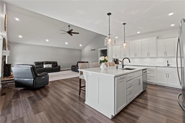 6417 County Road 10508th Rd, Rich Hill, MO 64779 - kitchen featuring appliances with stainless steel finishes, open floor plan, white cabinetry, decorative backsplash, and dark wood-style floors