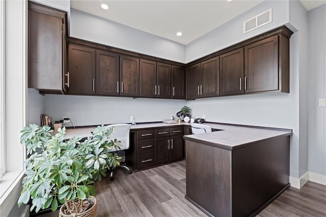 6417 County Road 10508th Rd, Rich Hill, MO 64779 - kitchen featuring dark brown cabinetry, wood finished floors, a peninsula, recessed lighting, and an office area