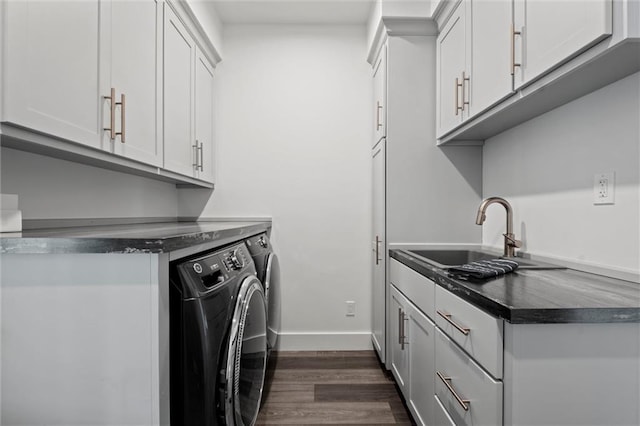 6417 County Road 10508th Rd, Rich Hill, MO 64779 - washroom featuring washer and clothes dryer, dark wood finished floors, and cabinet space