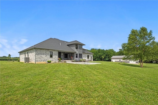 6417 County Road 10508th Rd, Rich Hill, MO 64779 - back of property with a patio and a yard