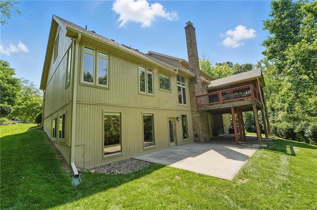 6112 N Mattox Rd, Kansas City, MO 64151 - rear view of house with a patio, a chimney, a yard, and a deck