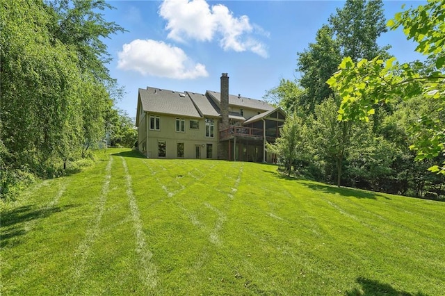6112 N Mattox Rd, Kansas City, MO 64151 - view of grassy yard with a wooden deck
