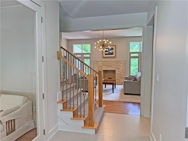 6112 N Mattox Rd, Kansas City, MO 64151 - stairway featuring plenty of natural light and a chandelier