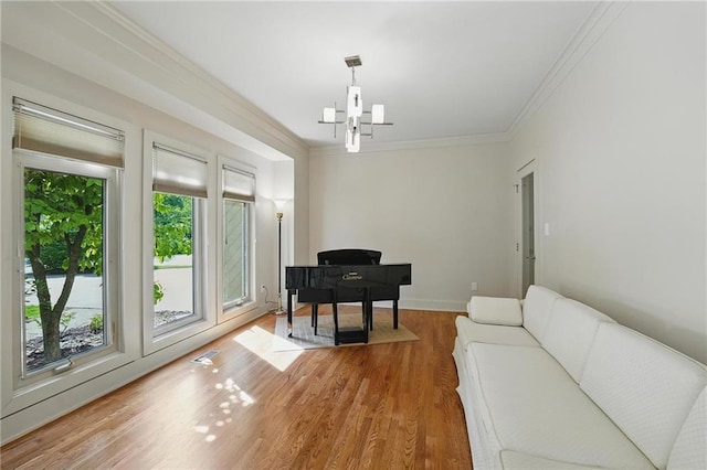 6112 N Mattox Rd, Kansas City, MO 64151 - sitting room with ornamental molding, light wood-style floors, and a chandelier