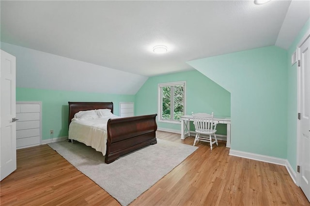 6112 N Mattox Rd, Kansas City, MO 64151 - bedroom with vaulted ceiling and light wood-type flooring