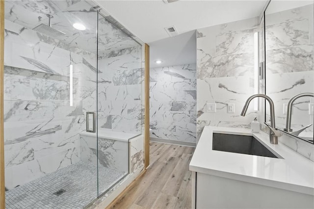 6112 N Mattox Rd, Kansas City, MO 64151 - full bathroom featuring wood finished floors, a marble finish shower, vanity, and recessed lighting