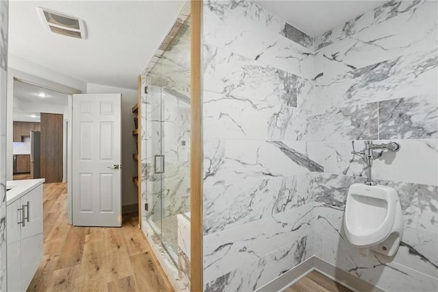 6112 N Mattox Rd, Kansas City, MO 64151 - bathroom with a marble finish shower, wood finished floors, a bidet, and vanity