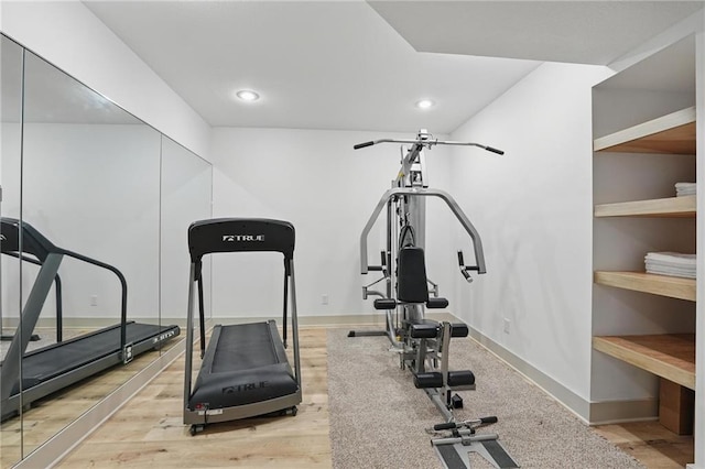 6112 N Mattox Rd, Kansas City, MO 64151 - exercise room with light wood-style flooring and recessed lighting