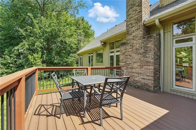 6112 N Mattox Rd, Kansas City, MO 64151 - wooden terrace with outdoor dining area
