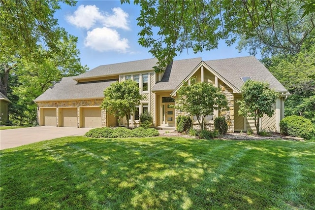 6112 N Mattox Rd, Kansas City, MO 64151 - view of front of house featuring stone siding, concrete driveway, and a front lawn