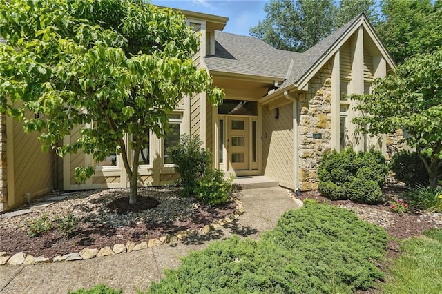 6112 N Mattox Rd, Kansas City, MO 64151 - view of front of home with stone siding and a shingled roof