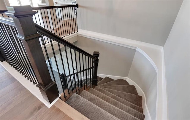 6045 Apache Dr, Shawnee, KS 66226 - stairs featuring wood finished floors