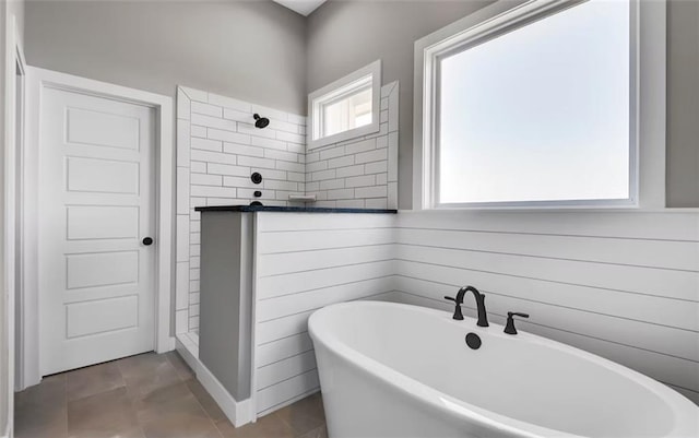 6045 Apache Dr, Shawnee, KS 66226 - full bathroom with a freestanding tub, tiled shower, and tile patterned flooring