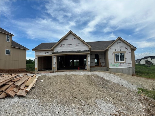 6045 Apache Dr, Shawnee, KS 66226 - property under construction featuring an attached garage and driveway