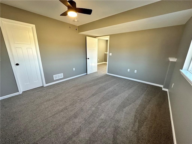 318 NE 51st Rd, Warrensburg, MO 64093 - unfurnished bedroom with dark carpet and ceiling fan
