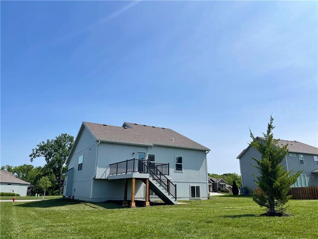 1116 SW Whispering Willow Way, Blue Springs, MO 64064 - back of property featuring stairway and a wooden deck