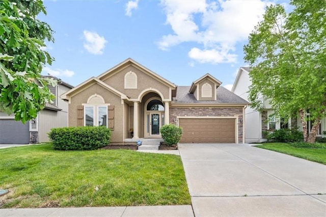 18783 W 165th St, Olathe, KS 66062 - single story home featuring an attached garage, driveway, a front lawn, and stone siding