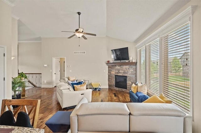 18783 W 165th St, Olathe, KS 66062 - living area with ceiling fan, a stone fireplace, wood finished floors, lofted ceiling, and ornamental molding