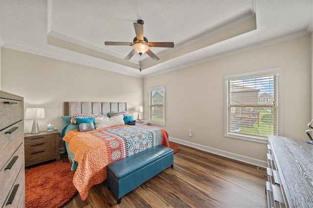 18783 W 165th St, Olathe, KS 66062 - bedroom featuring crown molding, a tray ceiling, multiple windows, dark wood-style flooring, and a ceiling fan