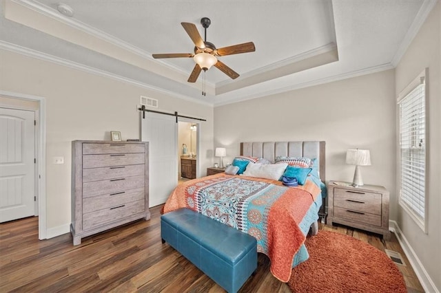 18783 W 165th St, Olathe, KS 66062 - bedroom with a barn door, ornamental molding, wood finished floors, a tray ceiling, and ensuite bath