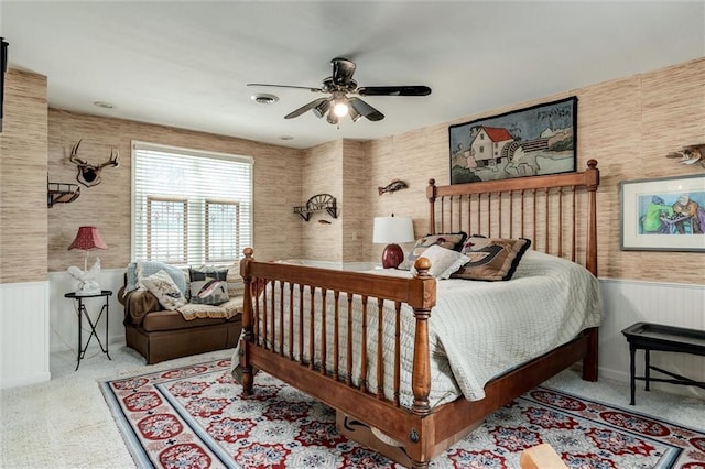 11 Dockside Dr, Lake Tapawingo, MO 64015 - bedroom featuring wainscoting, carpet flooring, wallpapered walls, and a ceiling fan