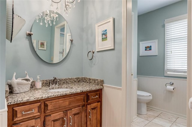 11 Dockside Dr, Lake Tapawingo, MO 64015 - bathroom featuring wainscoting, vanity, and a chandelier