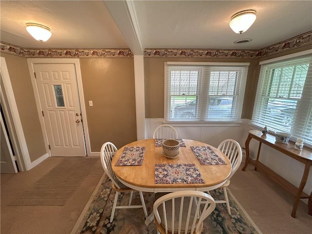 1047 N Lynn St, Nevada, MO 64772 - view of carpeted dining room