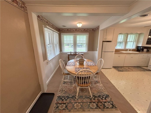 1047 N Lynn St, Nevada, MO 64772 - dining space with healthy amount of natural light