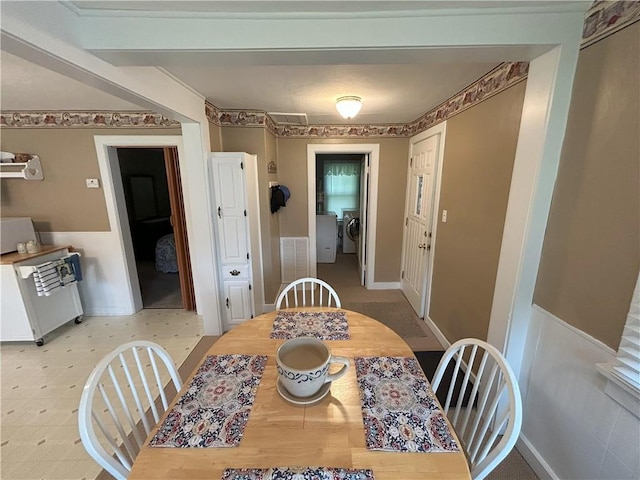 1047 N Lynn St, Nevada, MO 64772 - dining room with washer and dryer