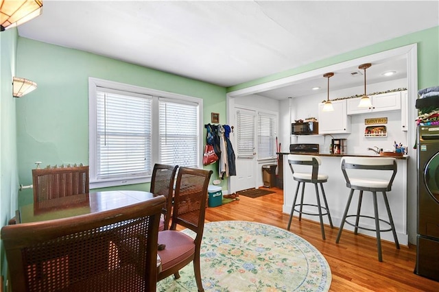212 Emanuel Cleaver Ii Blvd Unit 2West, Kansas City, MO 64112 - dining space featuring light wood finished floors and recessed lighting