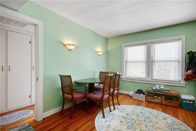 212 Emanuel Cleaver Ii Blvd Unit 2West, Kansas City, MO 64112 - dining room with wood finished floors