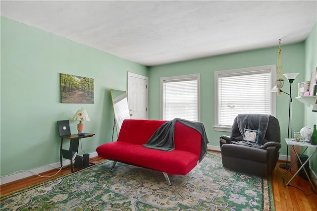 212 Emanuel Cleaver Ii Blvd Unit 2West, Kansas City, MO 64112 - living area with wood finished floors and baseboards